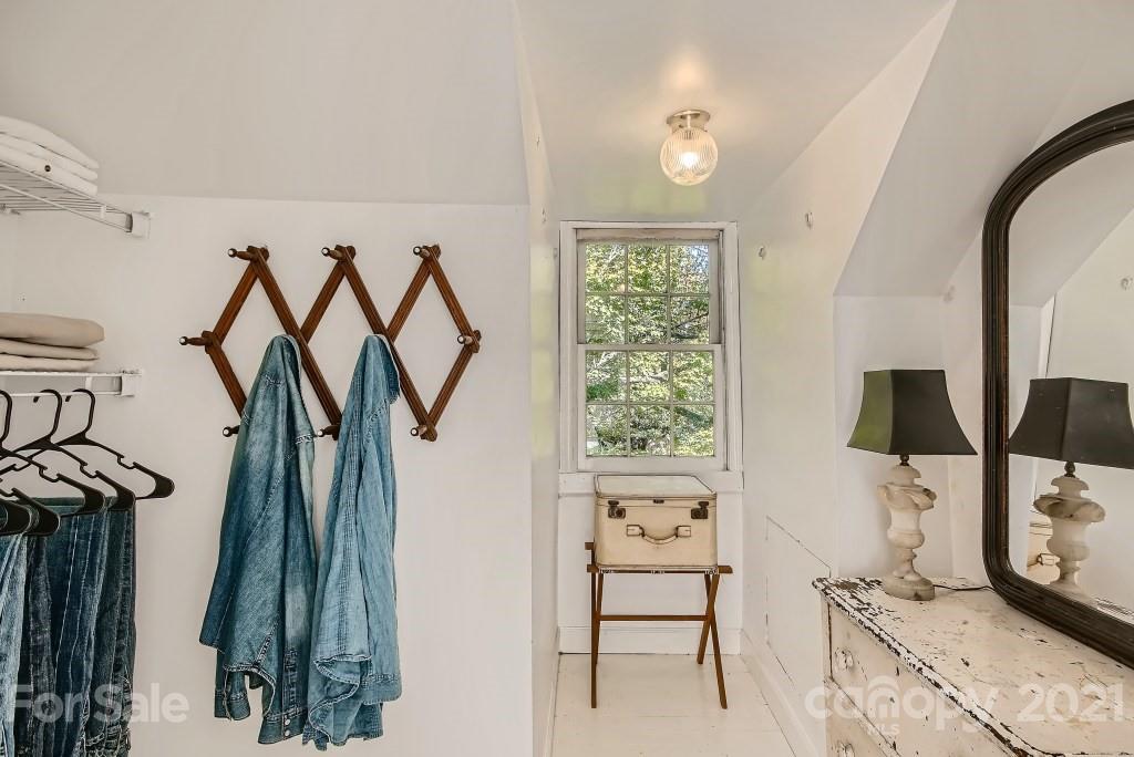 501 Marsh Road Charlotte, NC 28209 - Photo 20 of 27 a view of walk in closet with clothes and shoes