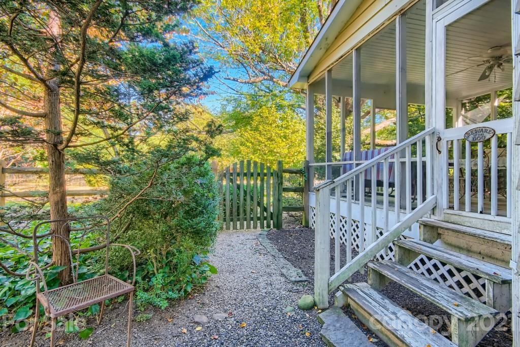 501 Marsh Road Charlotte, NC 28209 - Photo 26 of 27 a view of a wooden deck with a trees