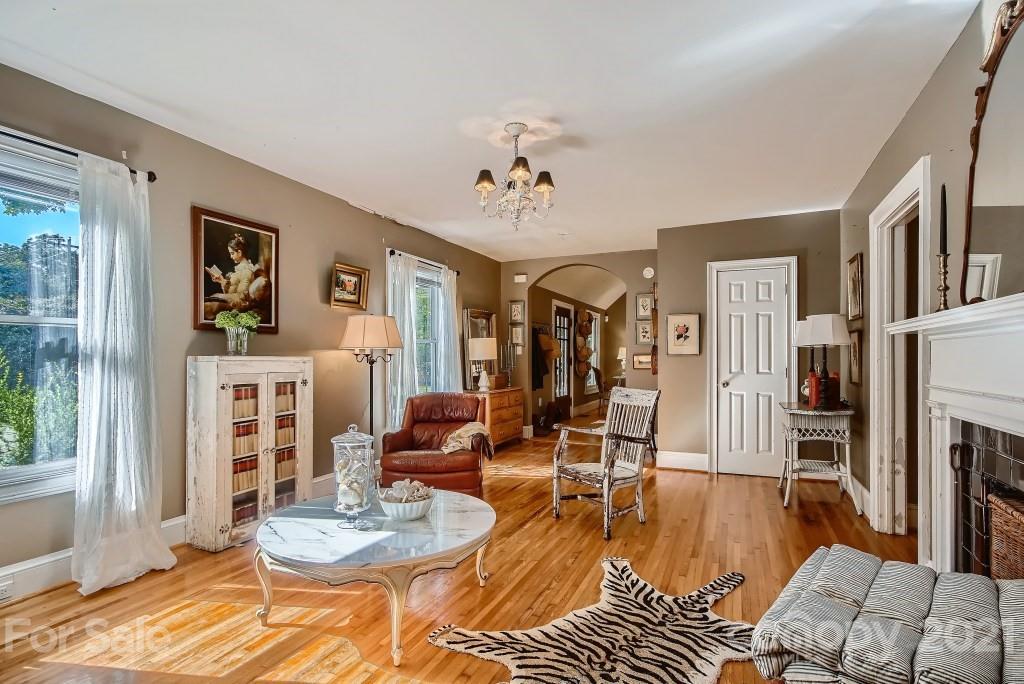 501 Marsh Road Charlotte, NC 28209 - Photo 6 of 27 a living room with furniture and a wooden floor