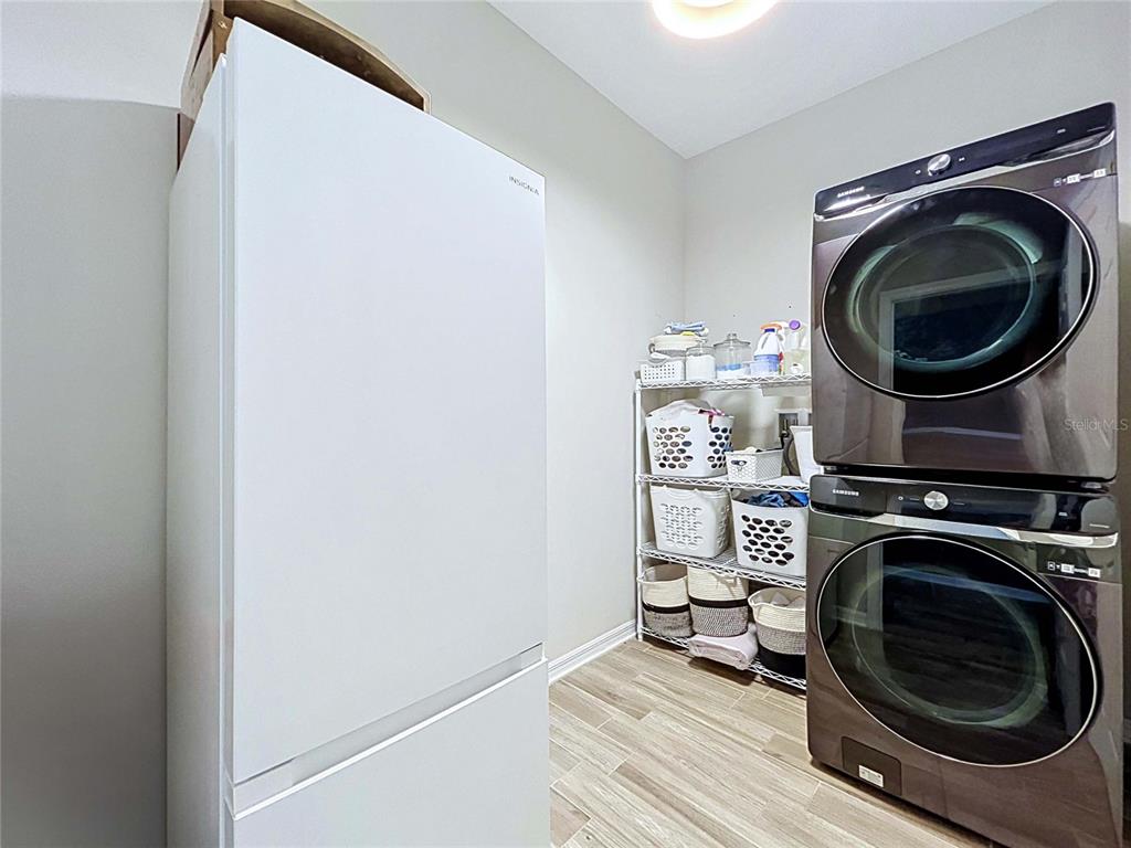 18078 Romanesque Court Spring Hill, FL 34610 - Photo 61 of 81 a utility room with sink dryer and washer