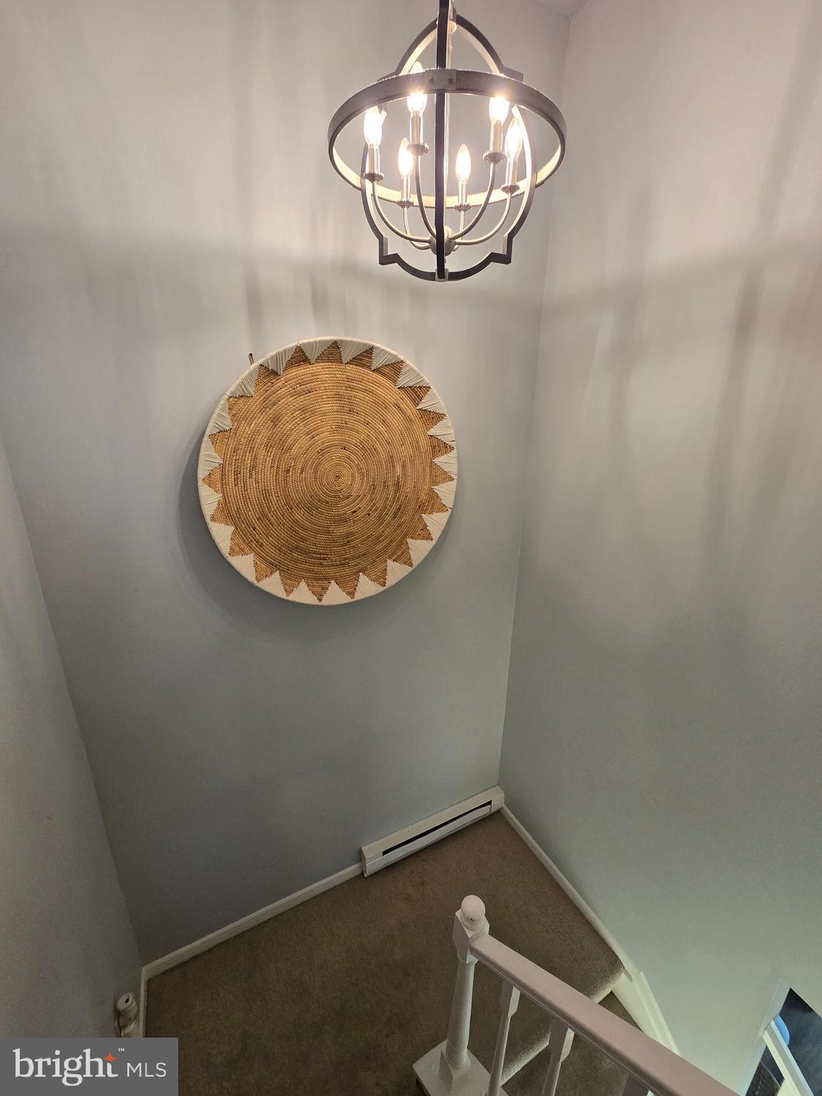 114 Delancy Place Lancaster, PA 17601 - Photo 14 of 24 an empty room with a chandelier fan and wooden floor