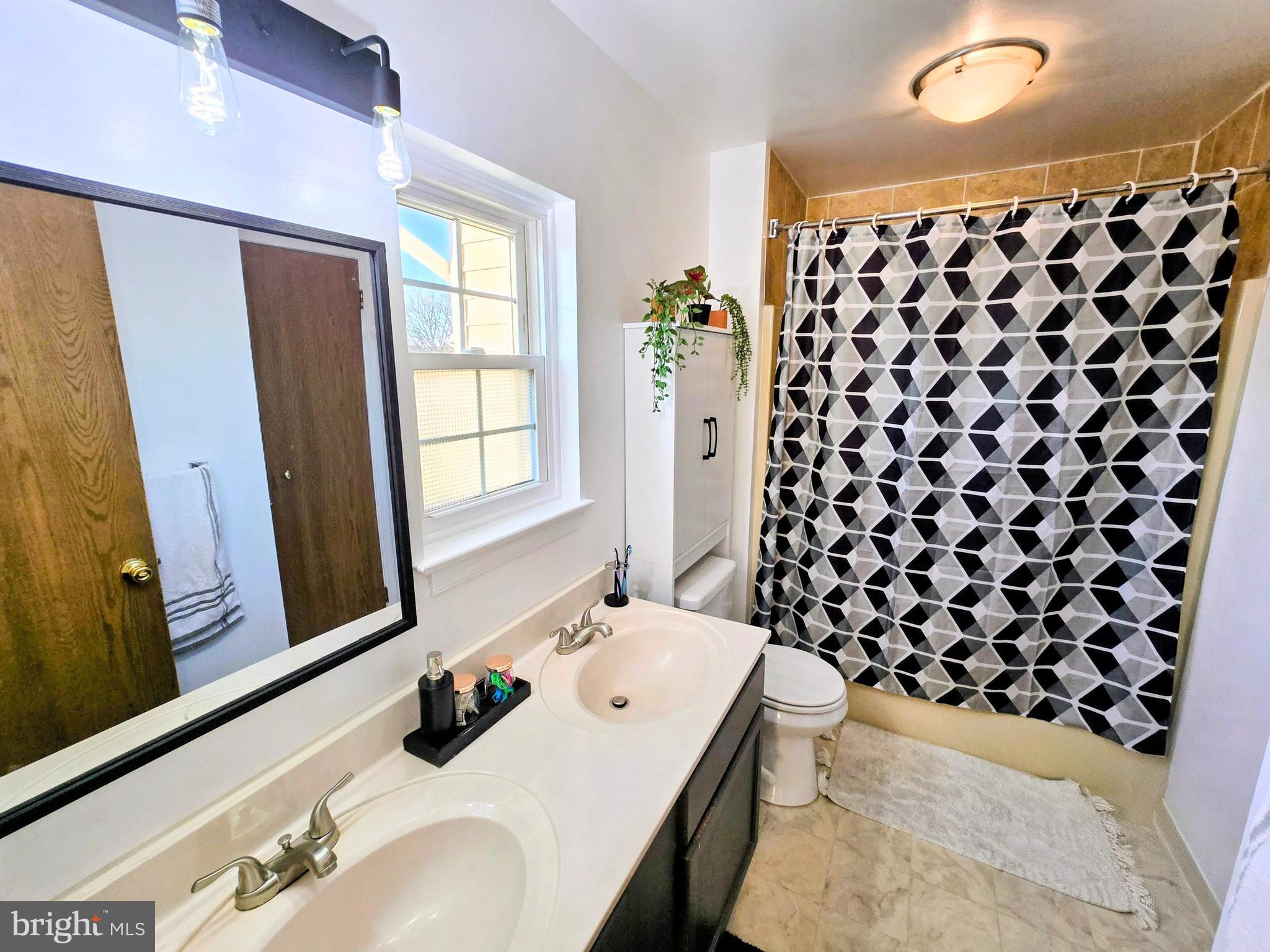 114 Delancy Place Lancaster, PA 17601 - Photo 17 of 24 a bathroom with a sink and a mirror