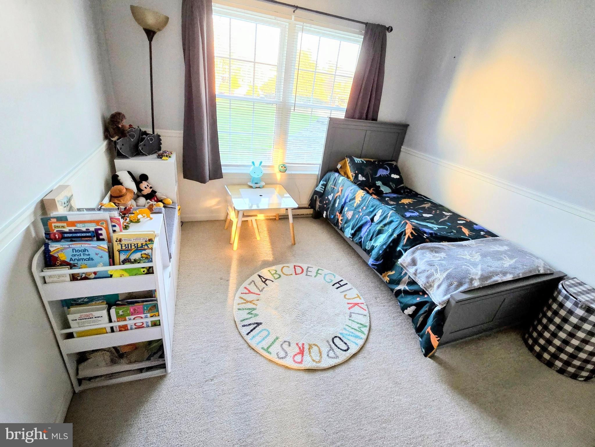 114 Delancy Place Lancaster, PA 17601 - Photo 20 of 24 a bed sitting in a bedroom next to a window