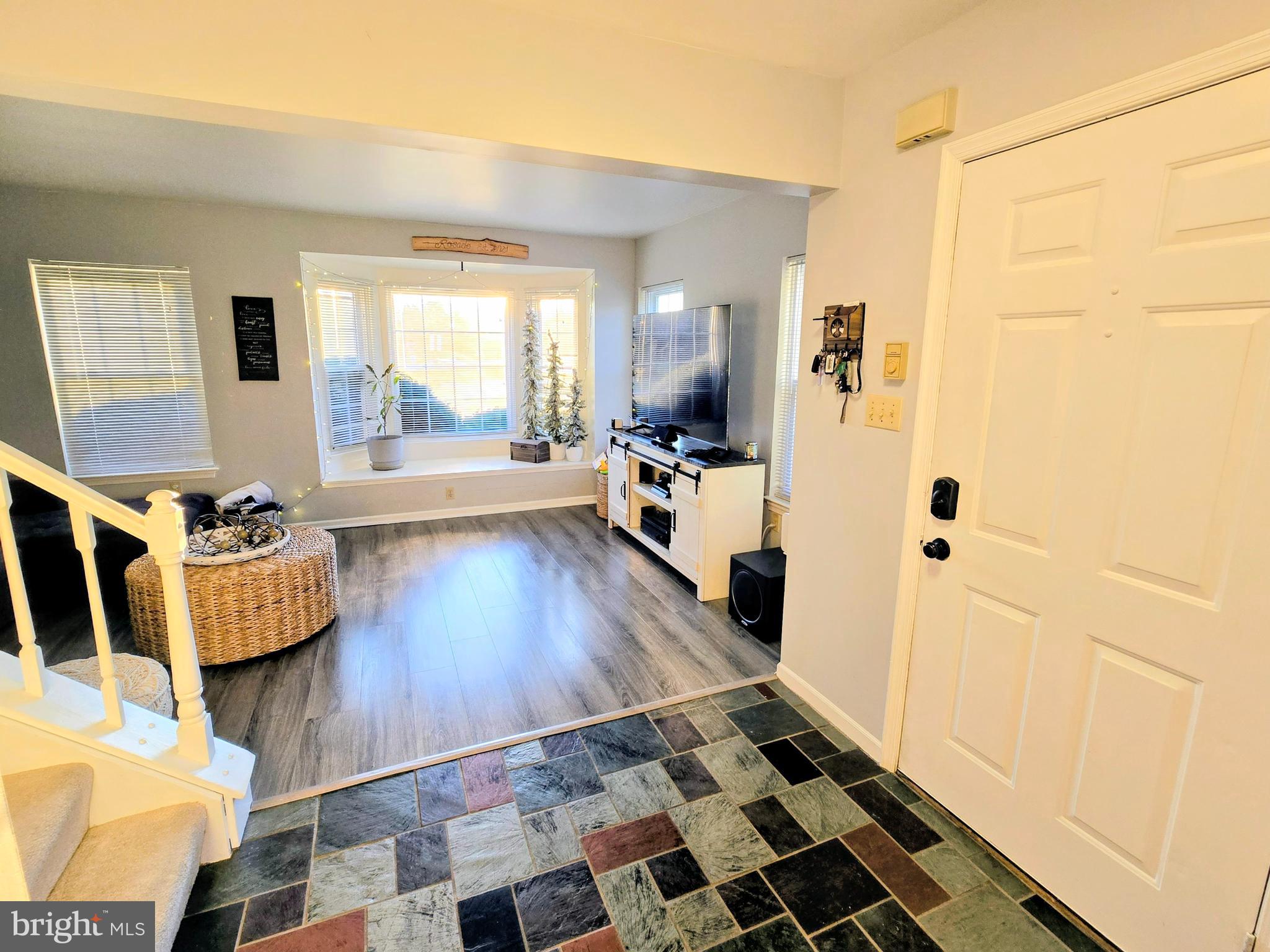 114 Delancy Place Lancaster, PA 17601 - Photo 3 of 24 a living room with a rug and a window