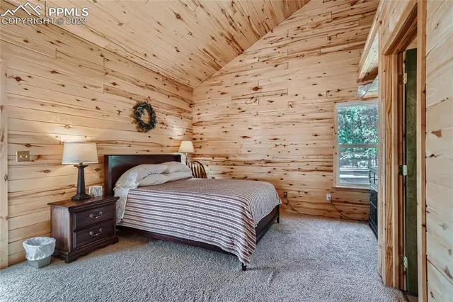 a bedroom with a bed and a cabinets