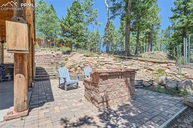 a view of a dinning tables and chairs in a patio