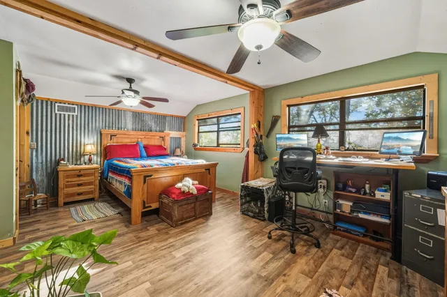 a living room with furniture a rug and a chandelier