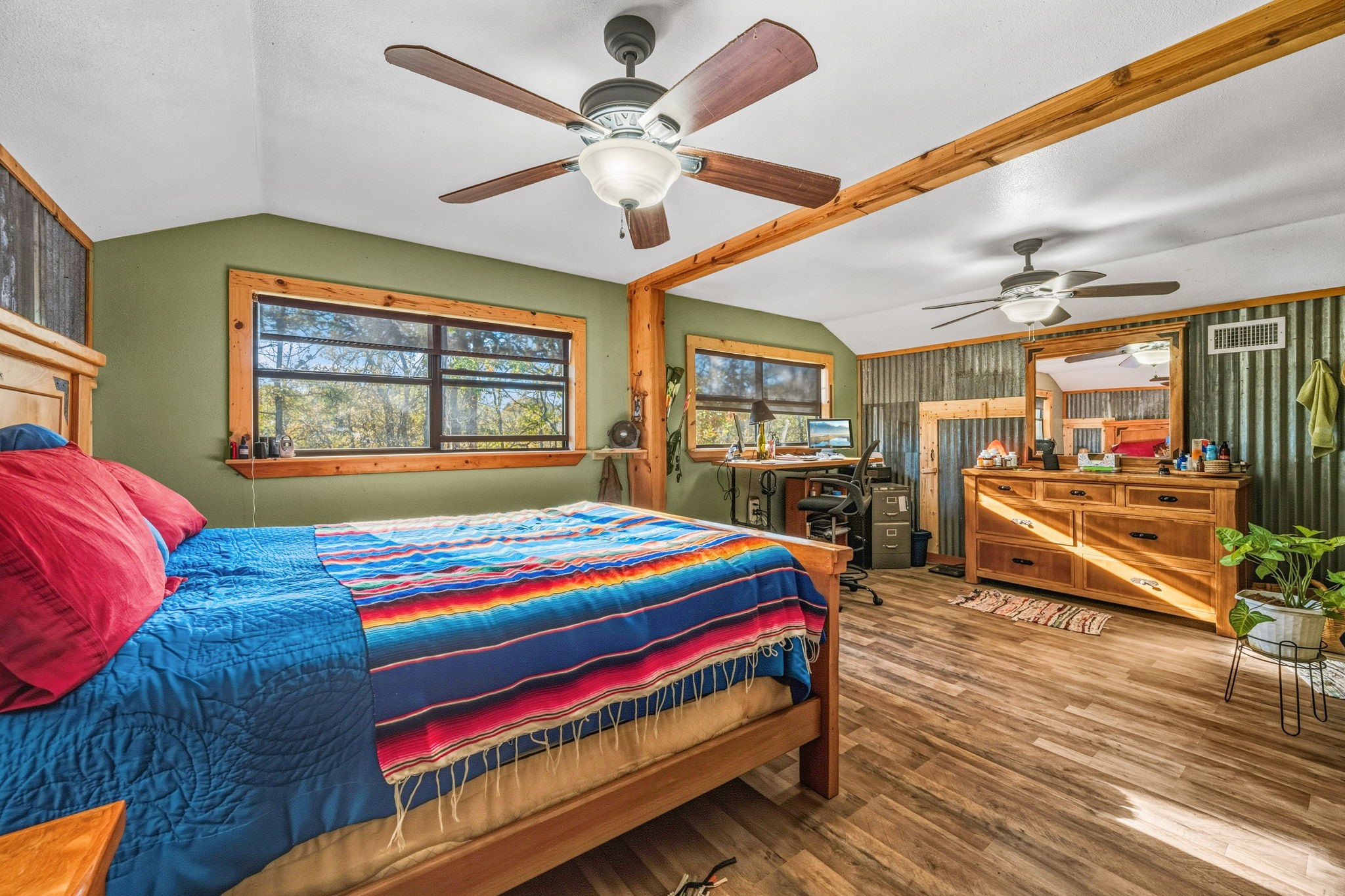 521 Camilla Lake Road Coldspring, TX 77331 - Photo 13 of 34 a bedroom with a bed and wooden floor