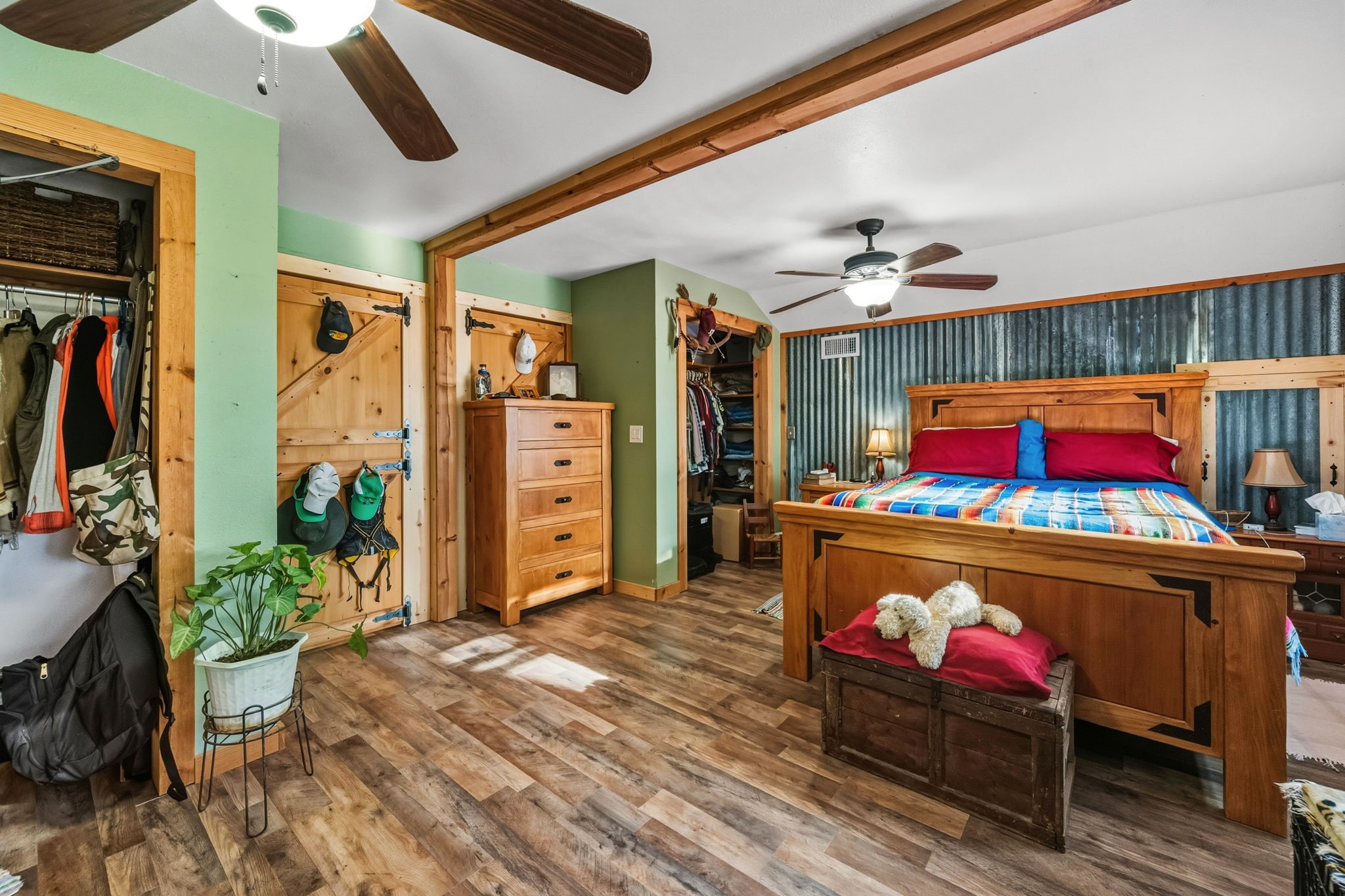 521 Camilla Lake Road Coldspring, TX 77331 - Photo 14 of 34 a bed room with furniture and a flat screen tv