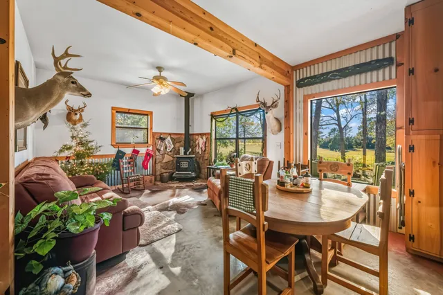 a view of a dining room with furniture window and outside view