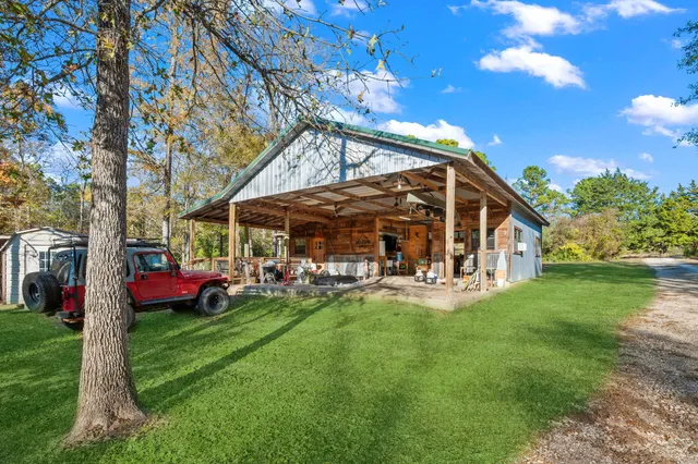 a view of a house with a yard porch and sitting area