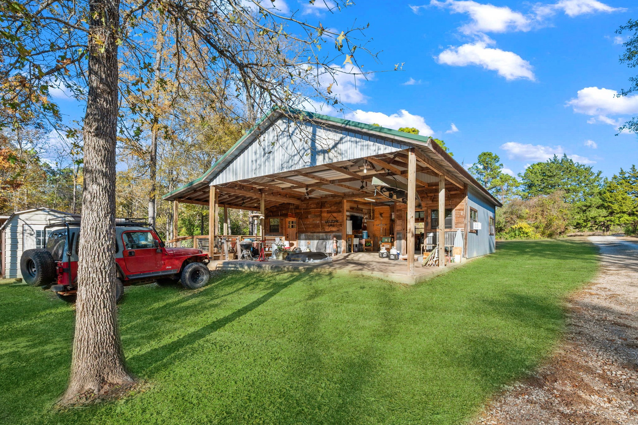 521 Camilla Lake Road Coldspring, TX 77331 - Photo 21 of 34 a view of a house with a yard porch and sitting area