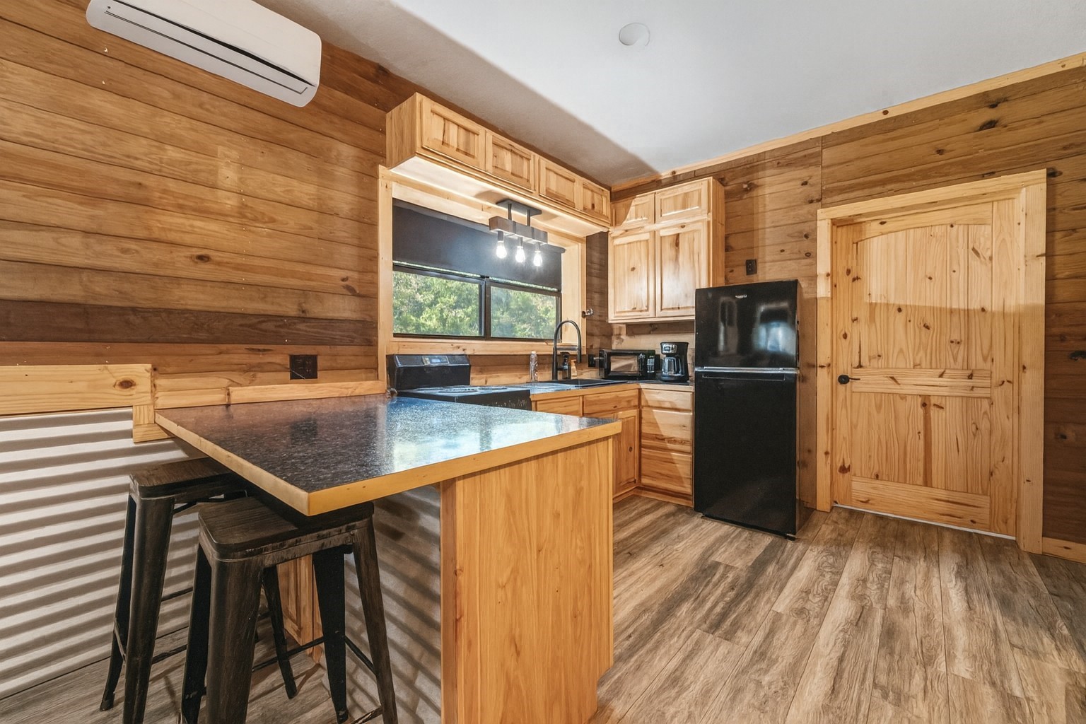 521 Camilla Lake Road Coldspring, TX 77331 - Photo 22 of 34 a kitchen with kitchen island a counter top space and stainless steel appliances