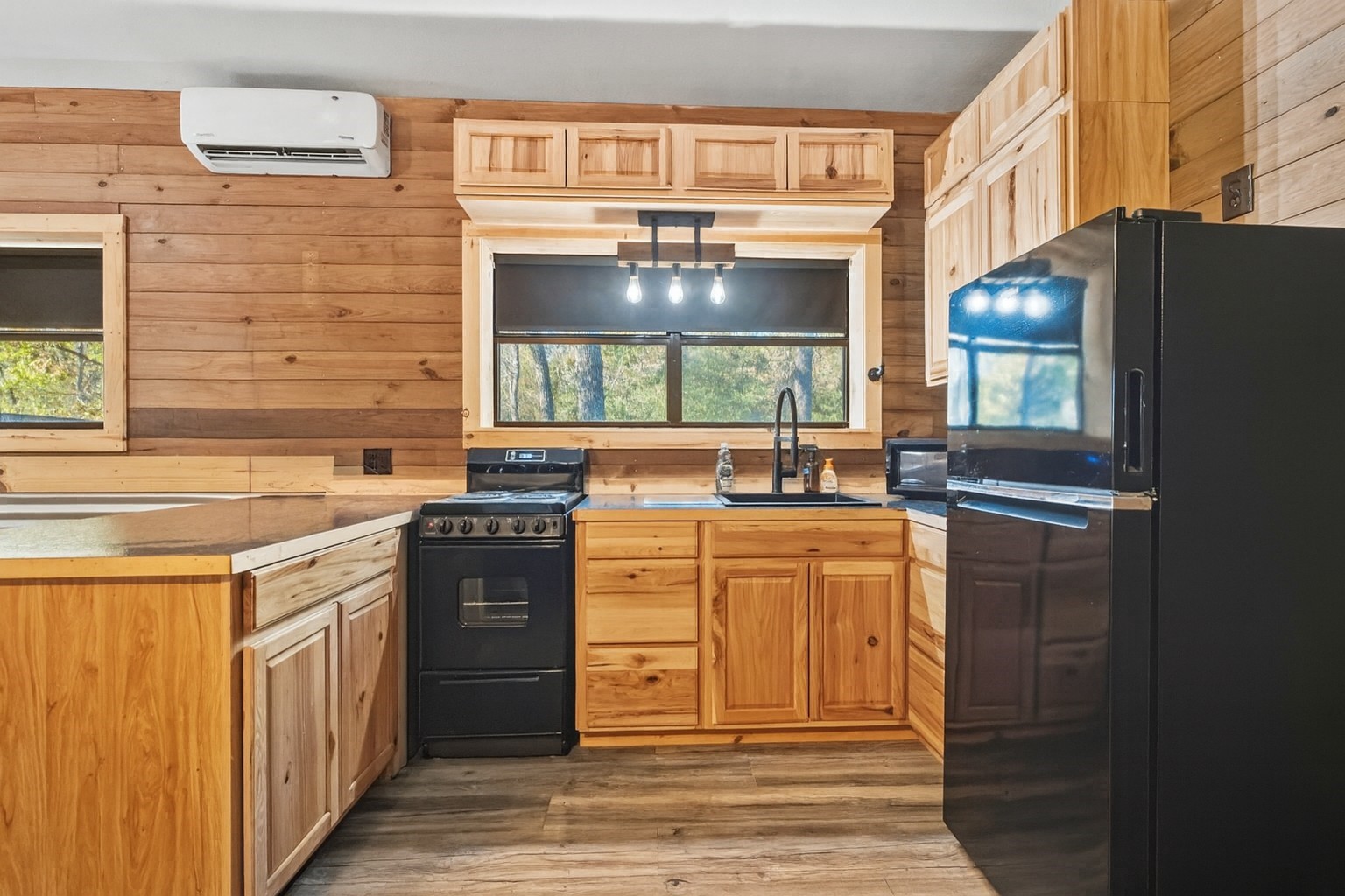 521 Camilla Lake Road Coldspring, TX 77331 - Photo 24 of 34 a kitchen with stainless steel appliances granite countertop a stove a sink and a refrigerator