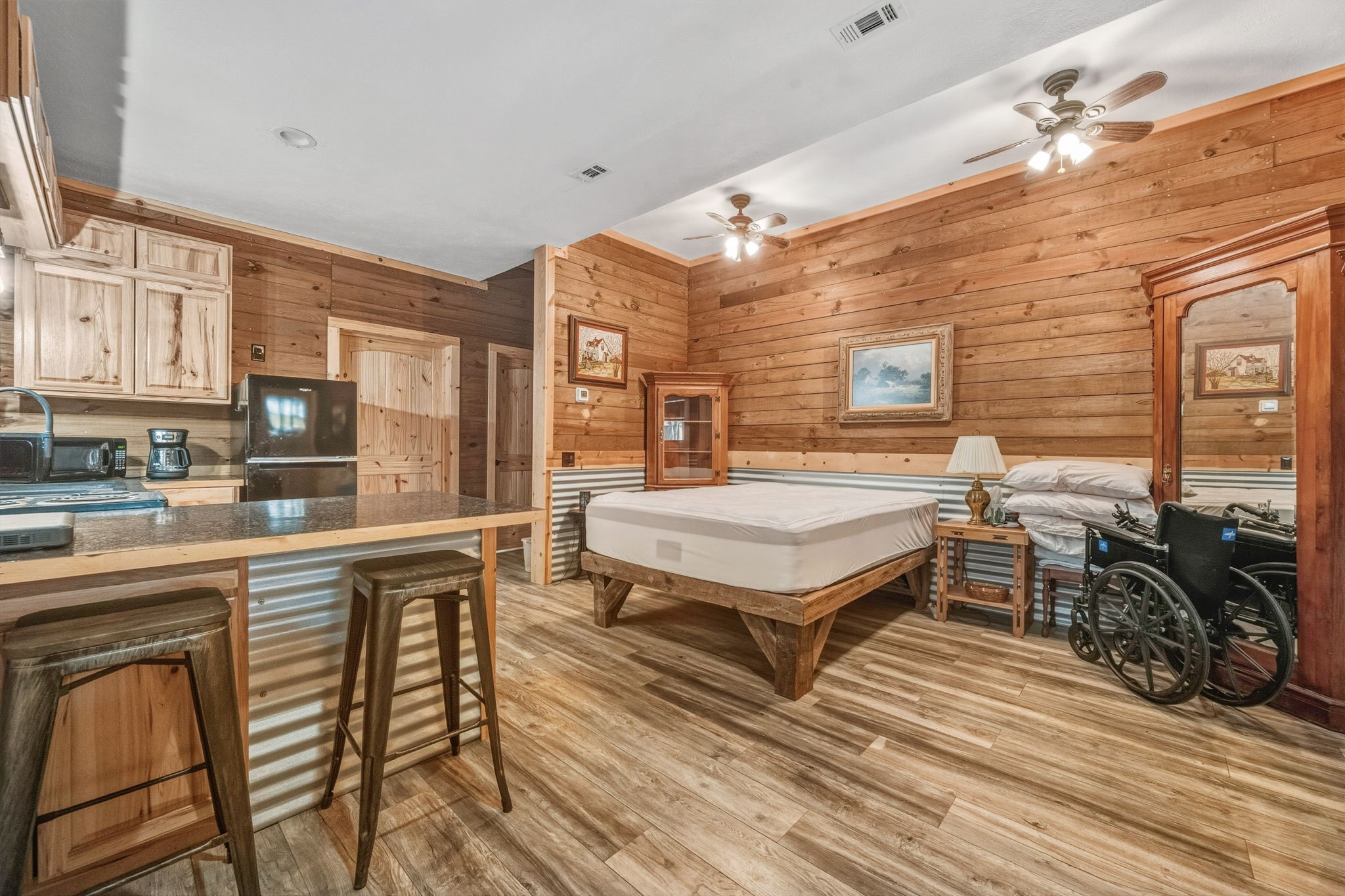 521 Camilla Lake Road Coldspring, TX 77331 - Photo 25 of 34 a spacious bedroom with a bed a table and chairs