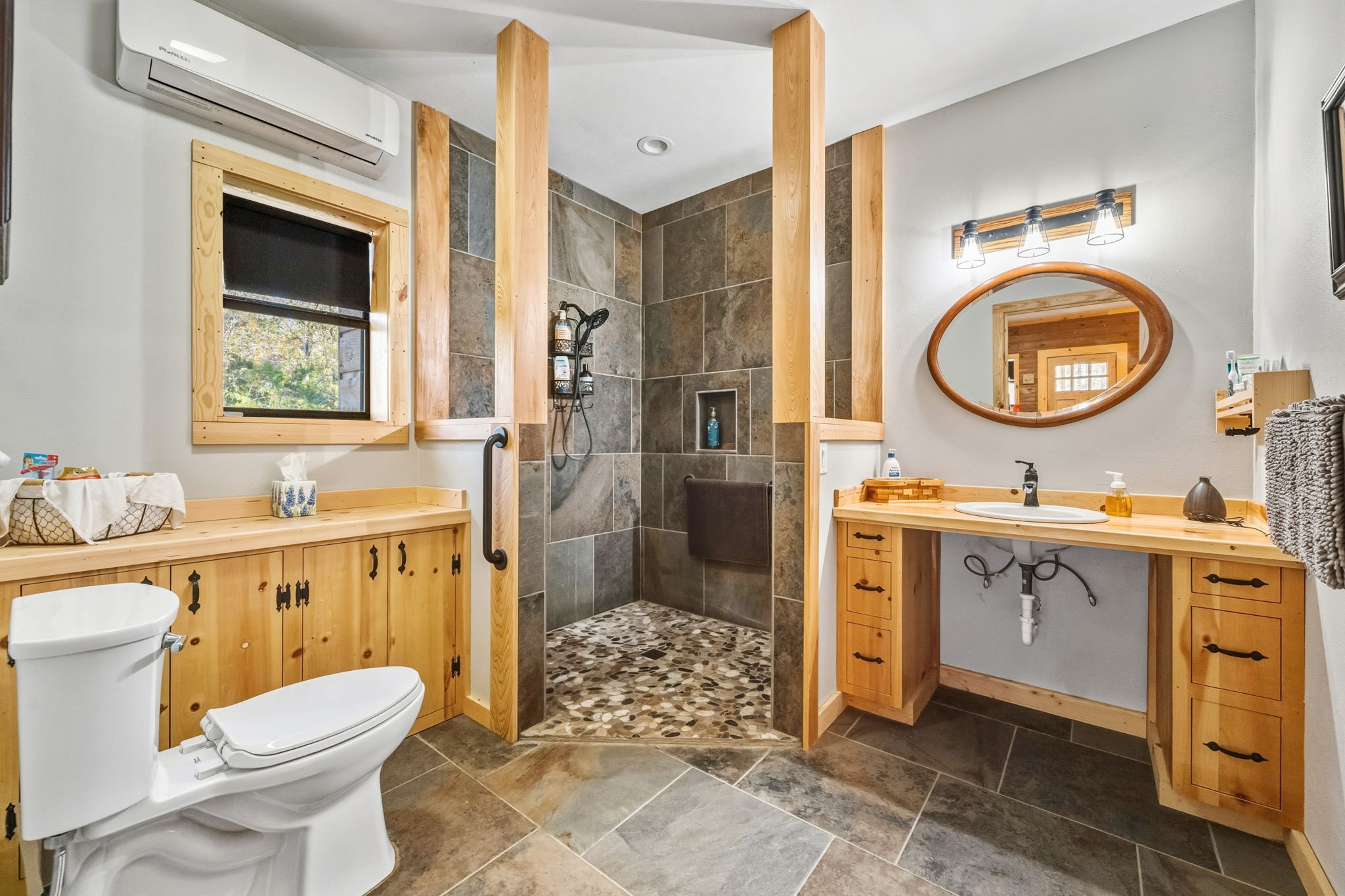 521 Camilla Lake Road Coldspring, TX 77331 - Photo 26 of 34 a bathroom with a granite countertop toilet sink and mirror