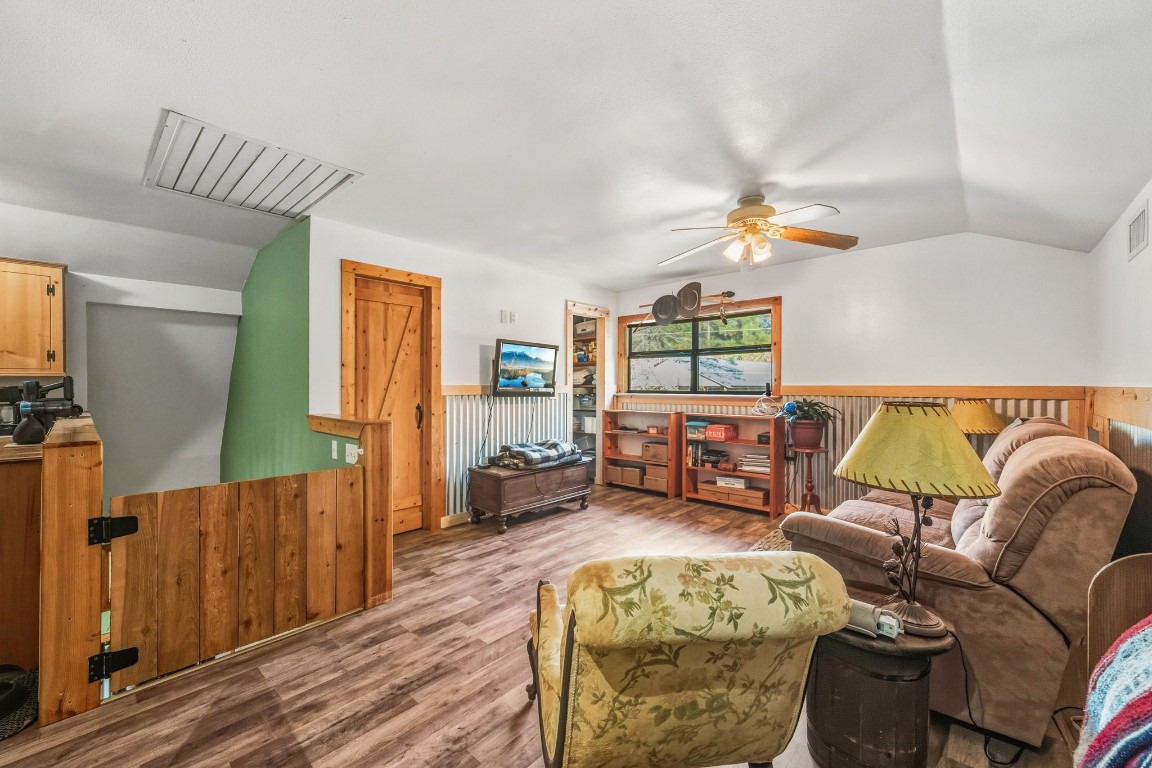 521 Camilla Lake Road Coldspring, TX 77331 - Photo 10 of 34 a living room with furniture and a wooden floor