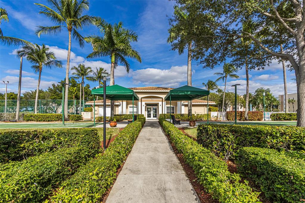 9539 Weldon Circle, Unit F201 Tamarac, FL 33321 - Photo 25 of 33 a view of a house with a yard
