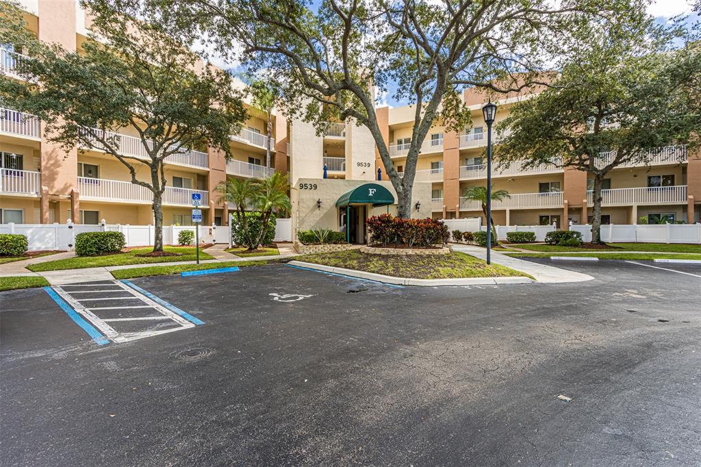 9539 Weldon Circle, Unit F201 Tamarac, FL 33321 - Photo 26 of 33 a front view of a building with street view