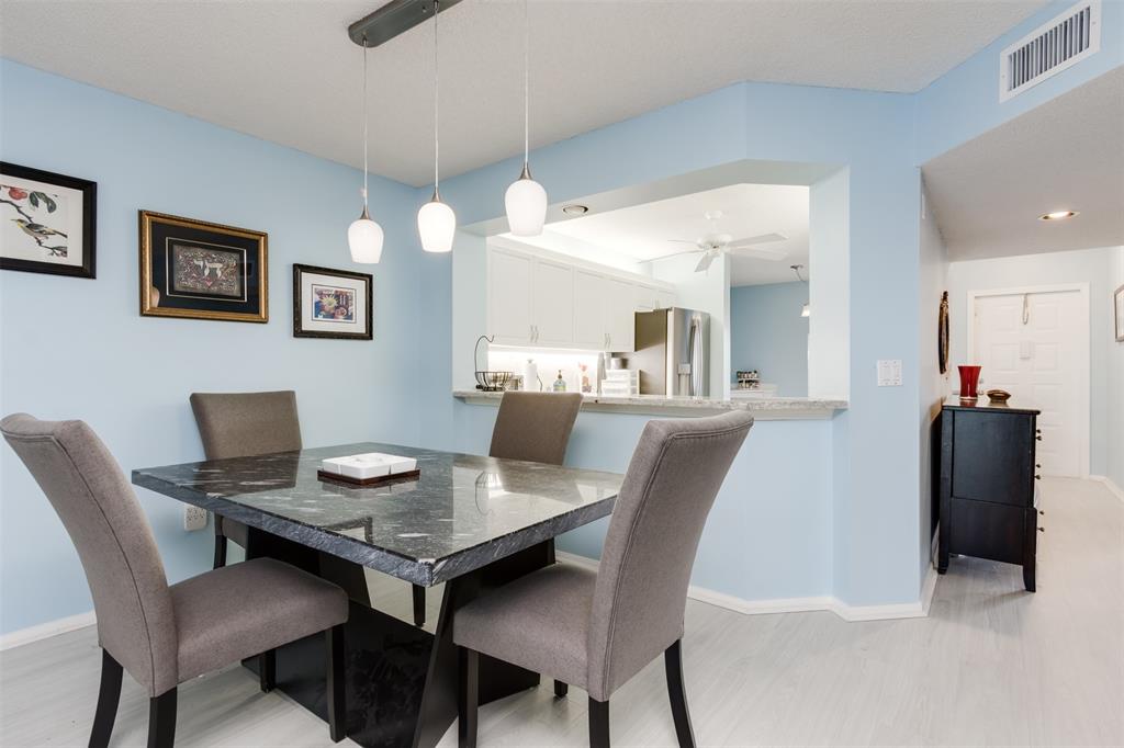 9539 Weldon Circle, Unit F201 Tamarac, FL 33321 - Photo 9 of 33 a view of a dining room with furniture and wooden floor