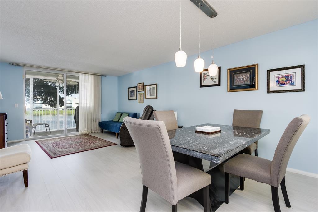 9539 Weldon Circle, Unit F201 Tamarac, FL 33321 - Photo 10 of 33 a view of a dining room with furniture