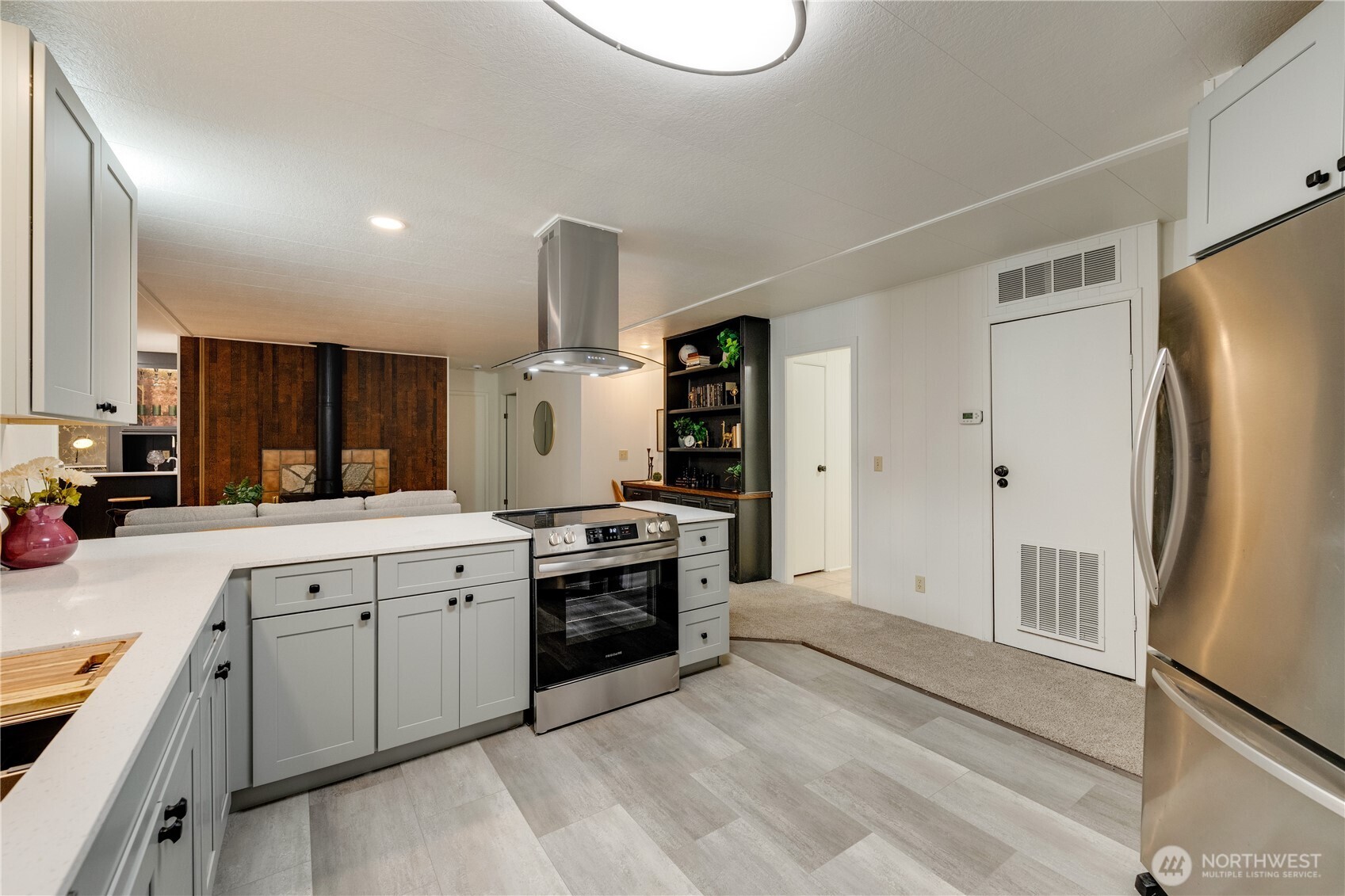 19305 127th Avenue Northeast Bothell, WA 98011 - Photo 13 of 38 a large kitchen with a sink stainless steel appliances and cabinets