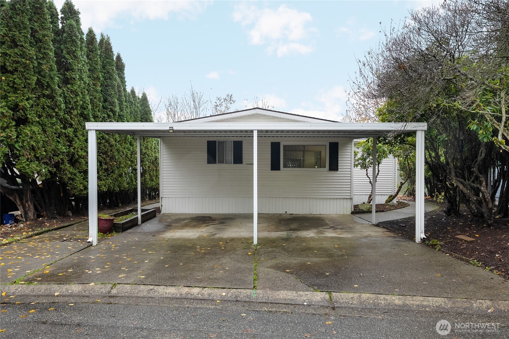 19305 127th Avenue Northeast Bothell, WA 98011 - Photo 2 of 38 a view of a house with backyard and a garage