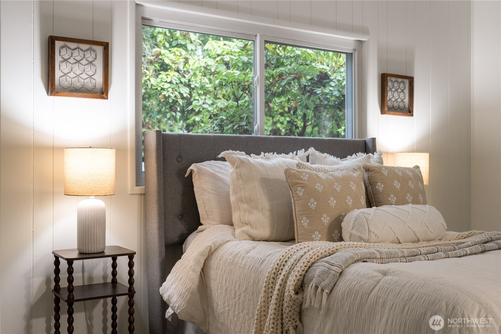 19305 127th Avenue Northeast Bothell, WA 98011 - Photo 23 of 38 a bed sitting in a bedroom next to a window