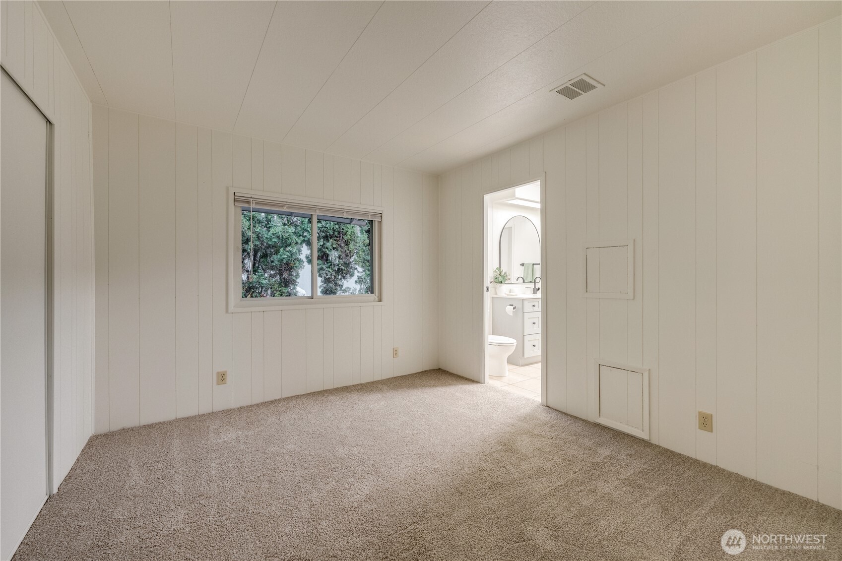 19305 127th Avenue Northeast Bothell, WA 98011 - Photo 29 of 38 an empty room with windows and closet