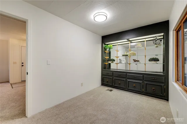 an empty room with furniture