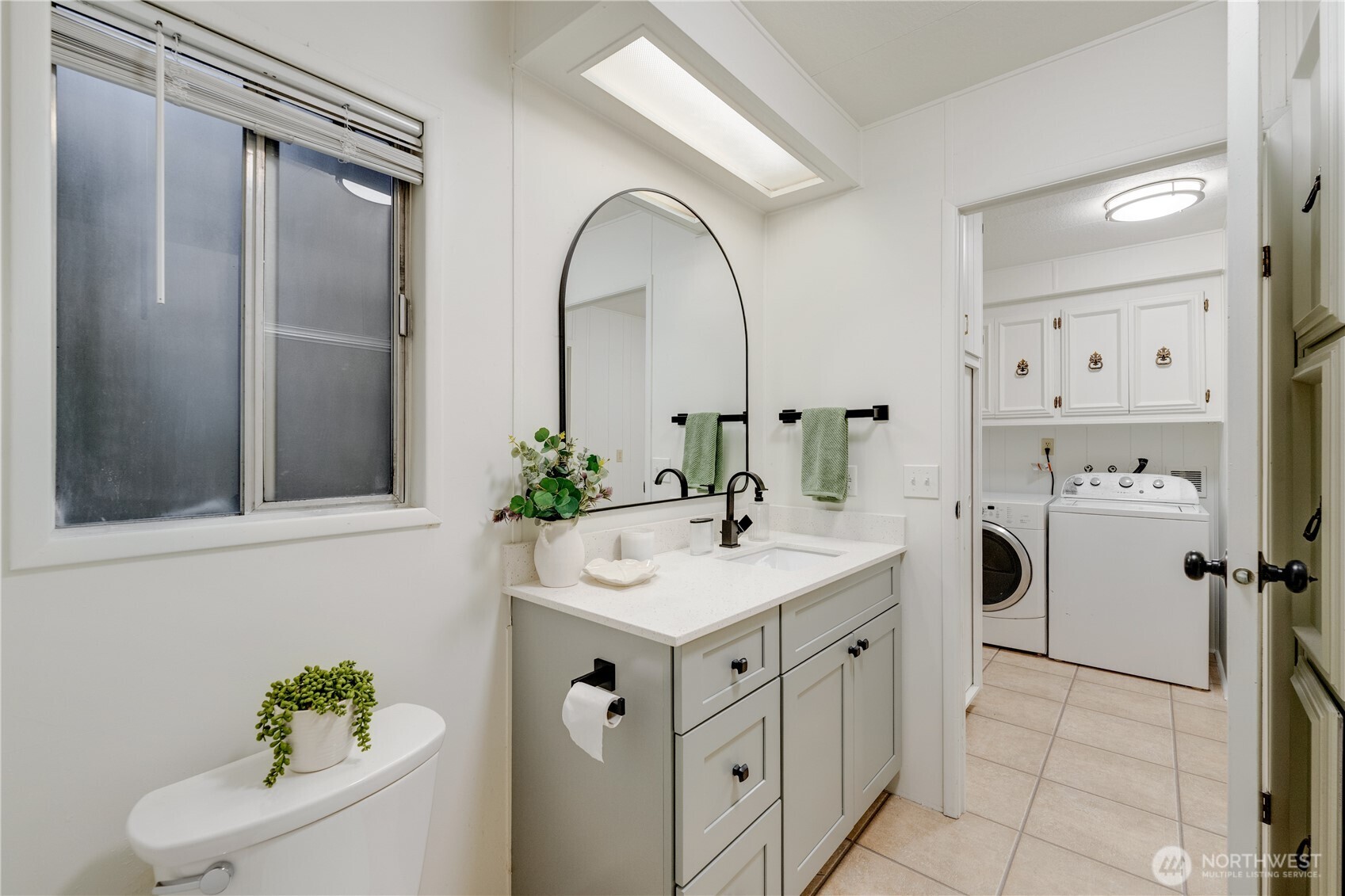 19305 127th Avenue Northeast Bothell, WA 98011 - Photo 35 of 38 a utility room with cabinets washer and dryer
