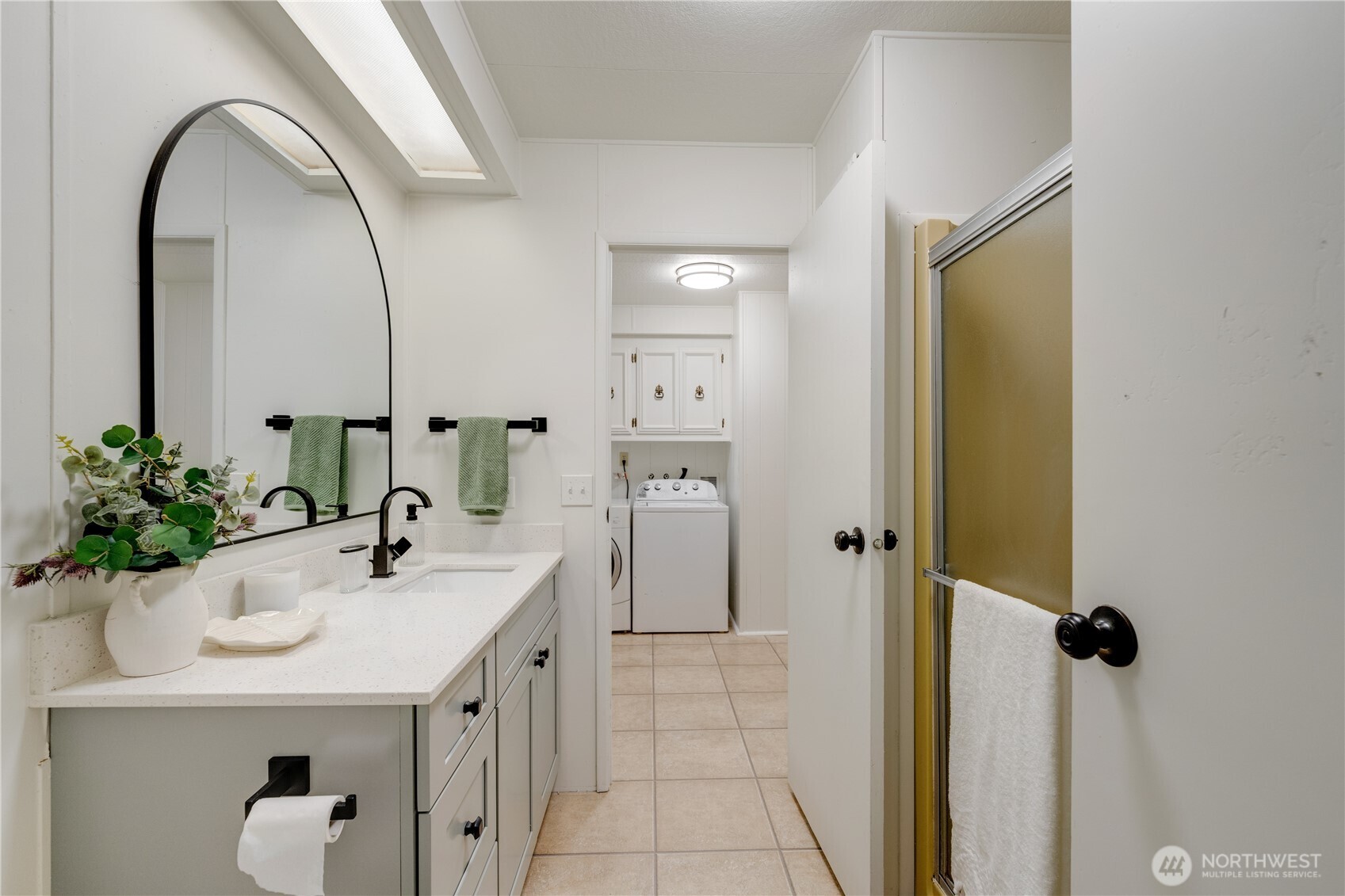 19305 127th Avenue Northeast Bothell, WA 98011 - Photo 37 of 38 a bathroom with a sink a toilet and shower