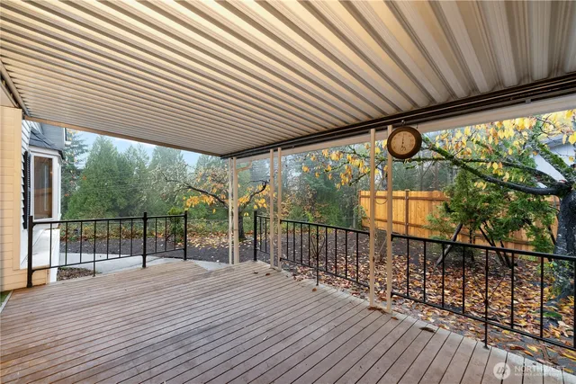 a view of a balcony with wooden floor