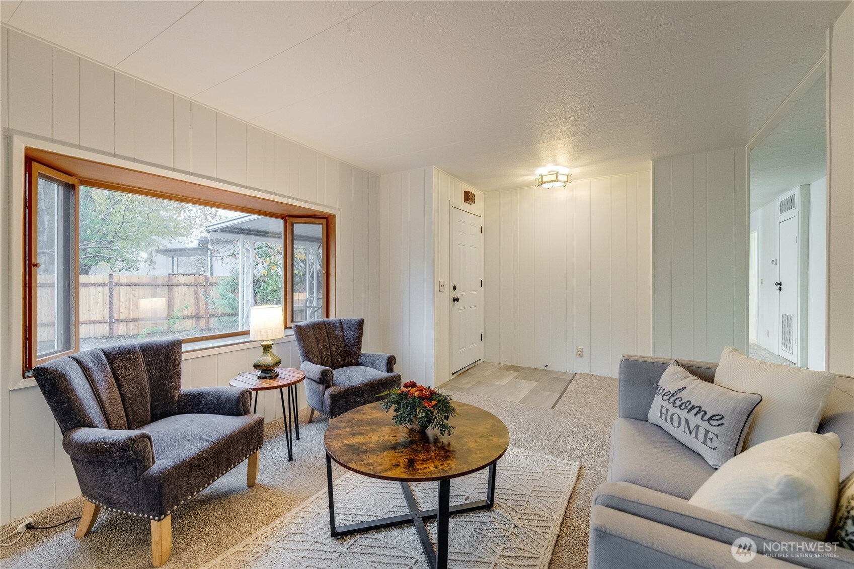19305 127th Avenue Northeast Bothell, WA 98011 - Photo 7 of 38 a living room with furniture and a large window
