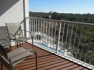 a view of swimming pool from a balcony