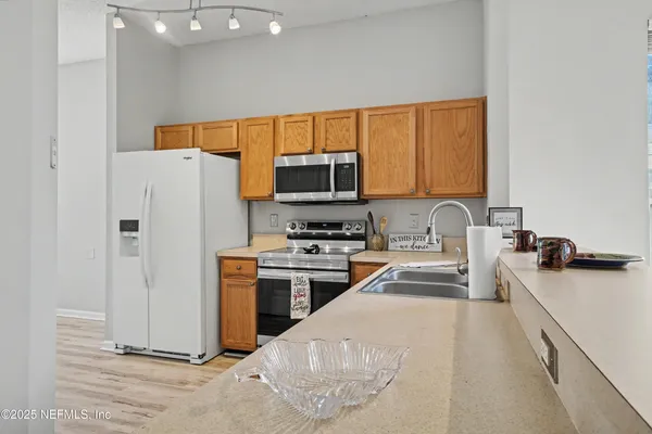 a view with kitchen island wooden floor
