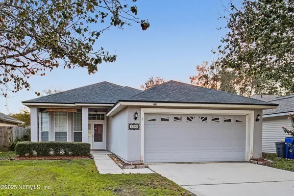 a kitchen with kitchen island wooden floor center island and stainless steel appliances