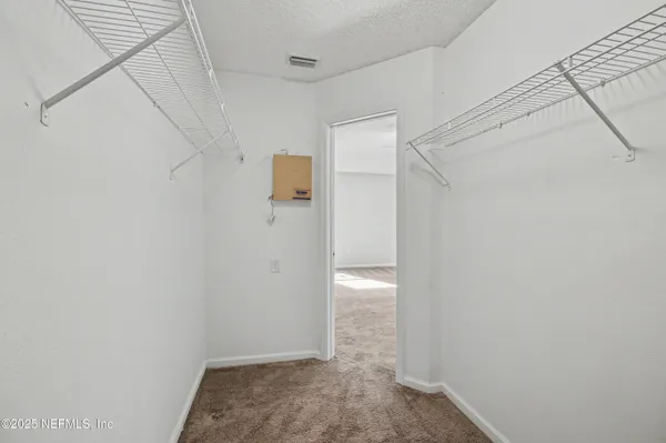 a spacious bathroom with a shower and a sink