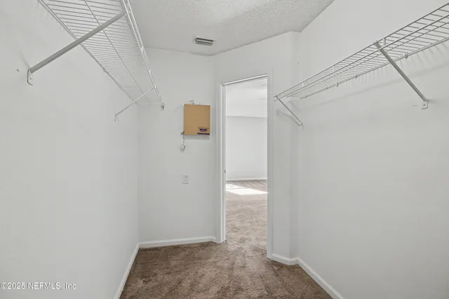 a bathroom with a sink toilet vanity and shower