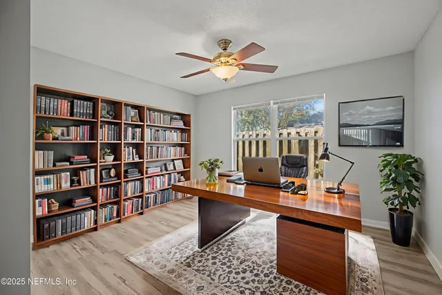 a view of a bathroom from a corridor