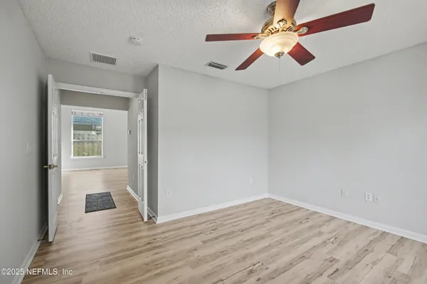 an empty room with a bathroom