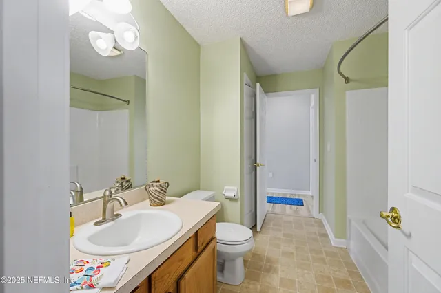 an empty room with a bathroom