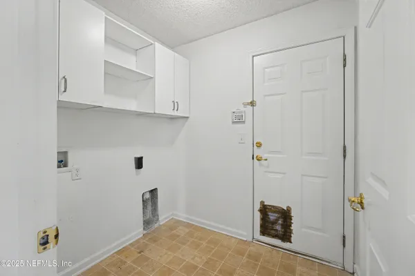 a view of an empty room with a fan