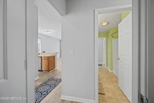 a view of an empty room with a fan