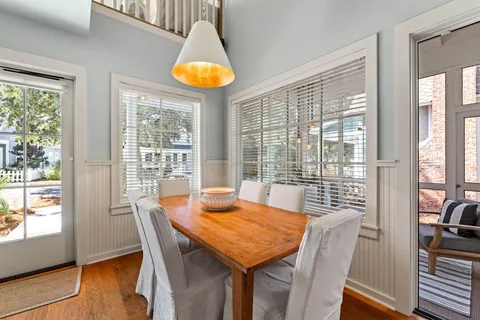 a view of a dining room with furniture window and wooden floor