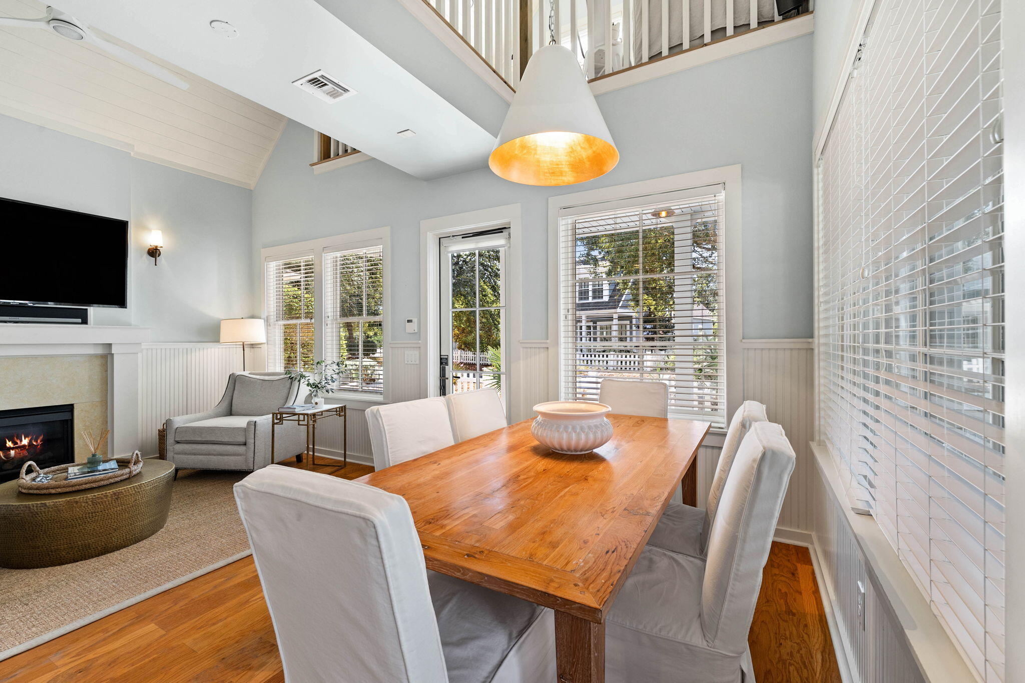 253 Salt Lane Watersound, FL 32461 - Photo 12 of 45 a view of a dining room with furniture window and a fireplace