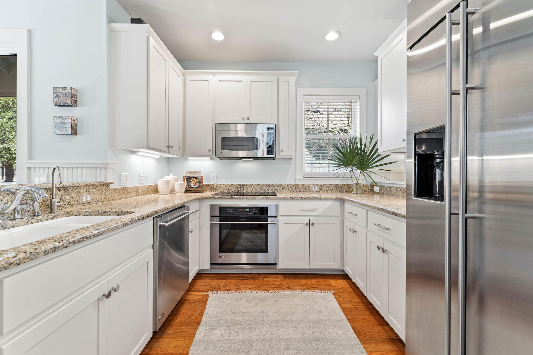 253 Salt Lane Watersound, FL 32461 - Photo 17 of 45 a kitchen with a sink stainless steel appliances and cabinets