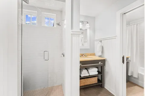 a room that has a bed and a table in it