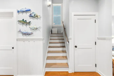 a living room with furniture flat screen tv and a couch
