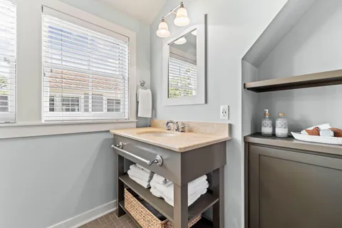 a bathroom with a toilet and a shower curtain